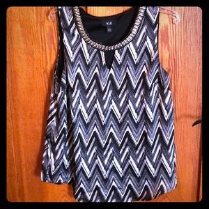 Jewel neck black and white sleeveless blouse